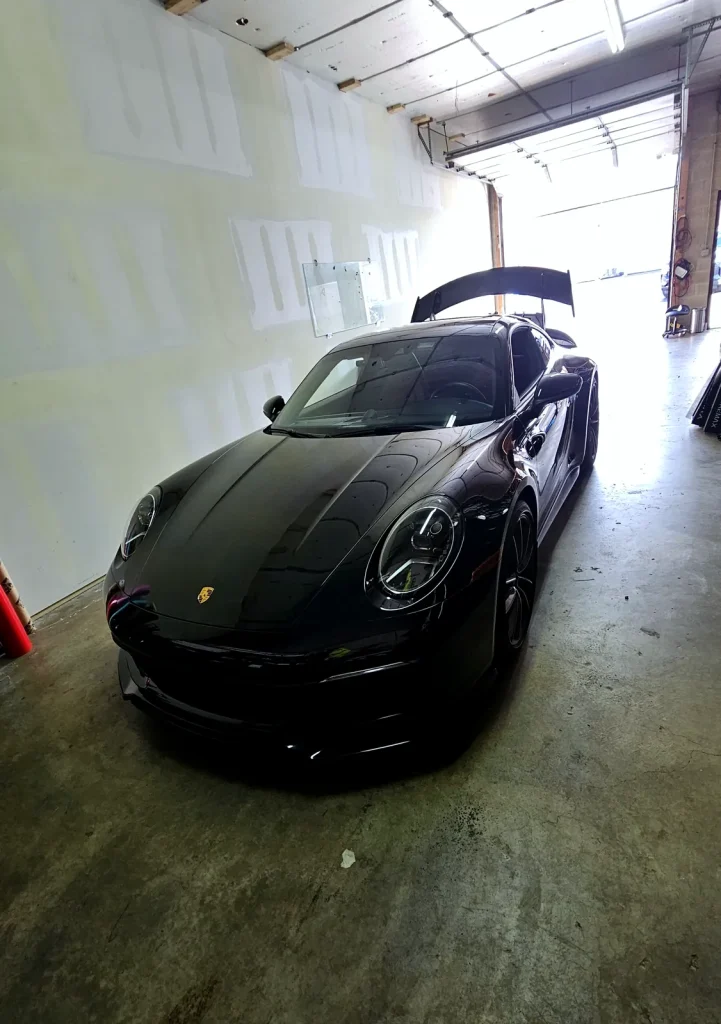 Black Porsche 911 GT3 with gloss paint protection film