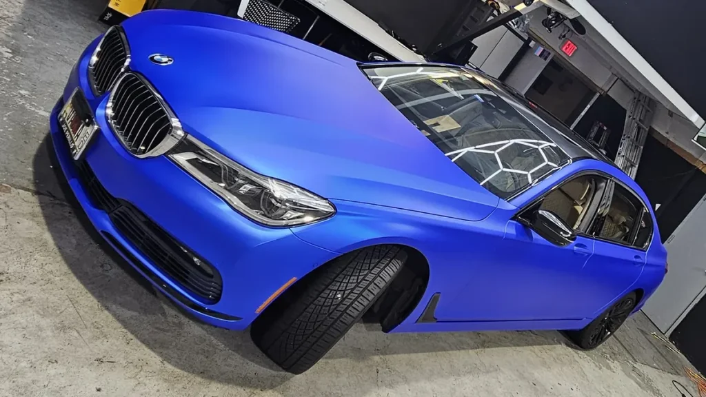 Matte blue wrap finish on a BMW 7 Series