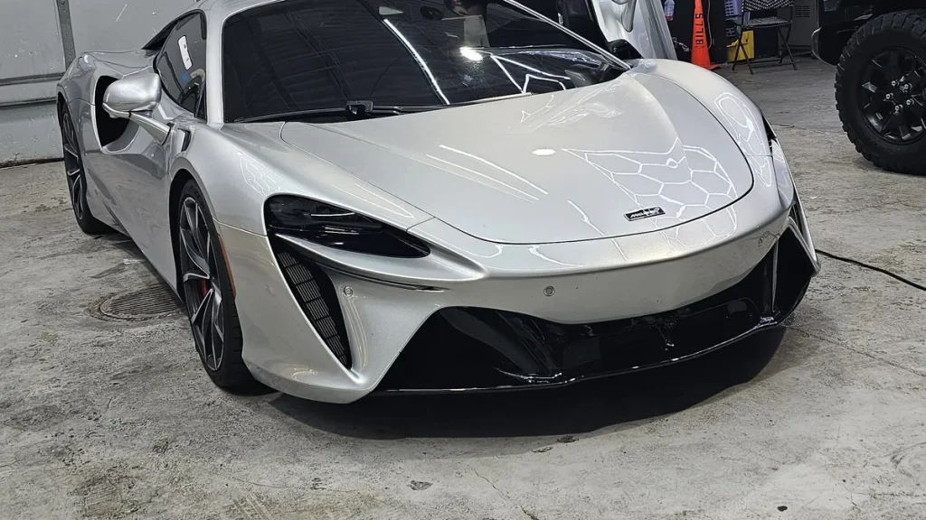 New car paint protection for a white McLaren Artura in the MLUX shop