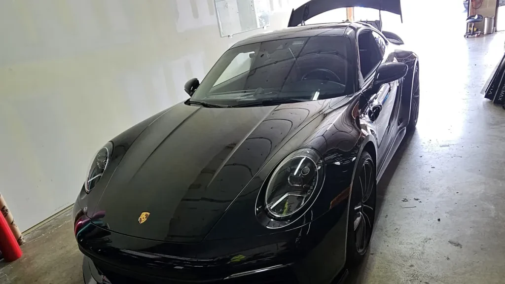 PPF vs ceramic coating: black Porsche 911 GT3 with paint protection film in the MLUX bay