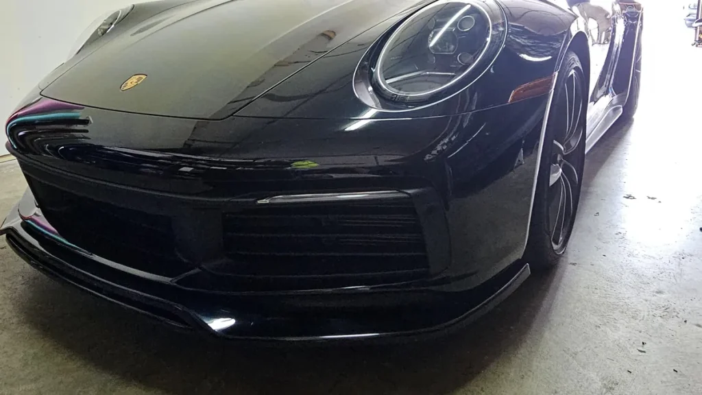 Self-healing PPF on a gloss black Porsche 911