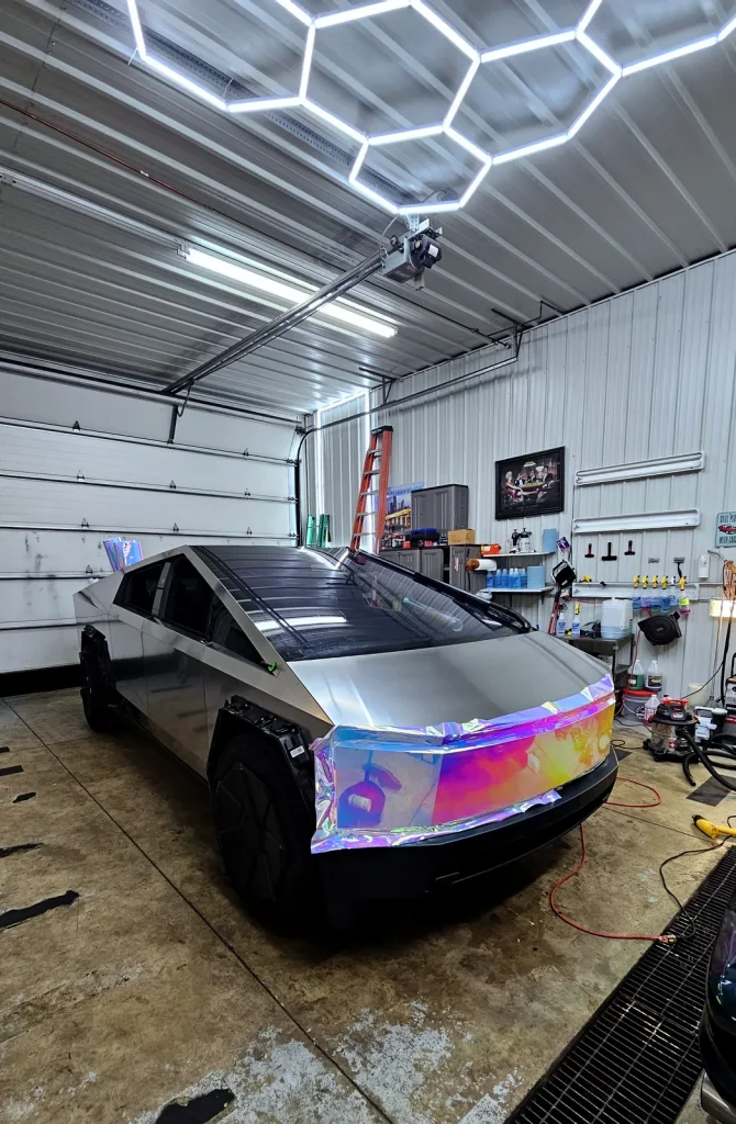 Tesla Cybertruck in a holographic color-shift vinyl wrap