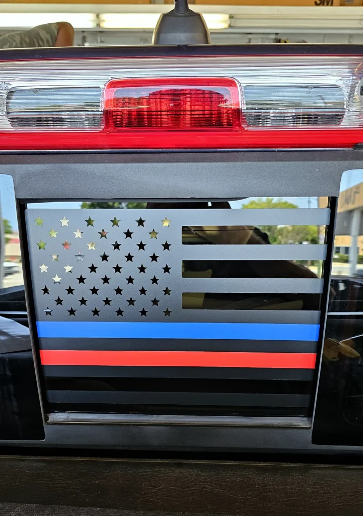 Custom American flag vinyl decal on a pickup truck tailgate