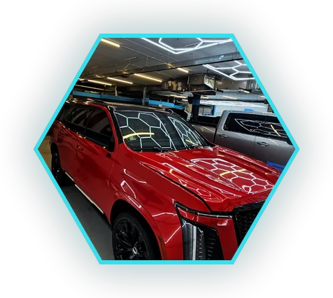 Gloss red Cadillac Escalade showing a gloss vinyl wrap finish