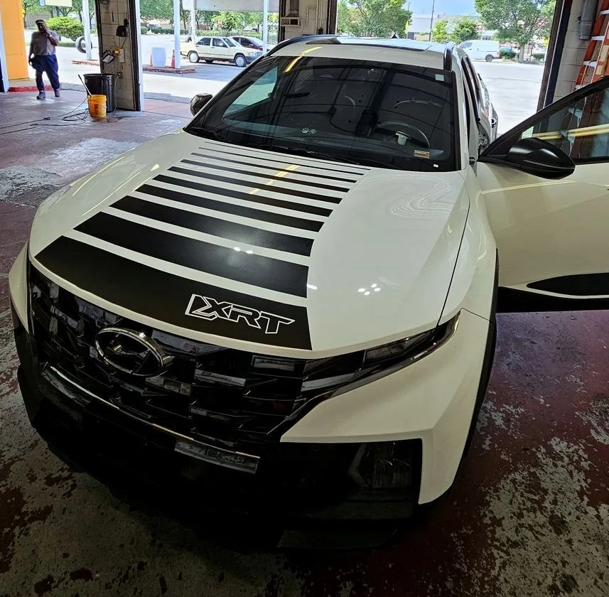 Black hood stripe vinyl graphics on a white Hyundai Santa Cruz