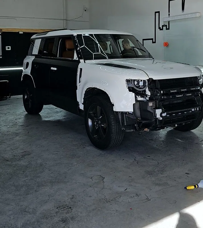 White Land Rover Defender before its matte black wrap