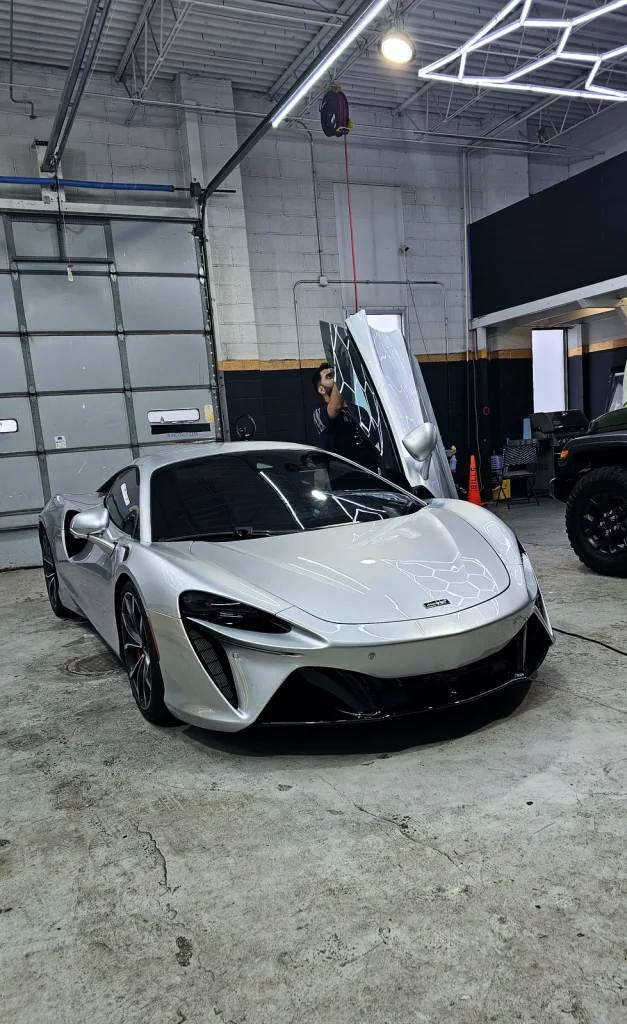 McLaren Artura parked inside the MLUX Auto Service shop