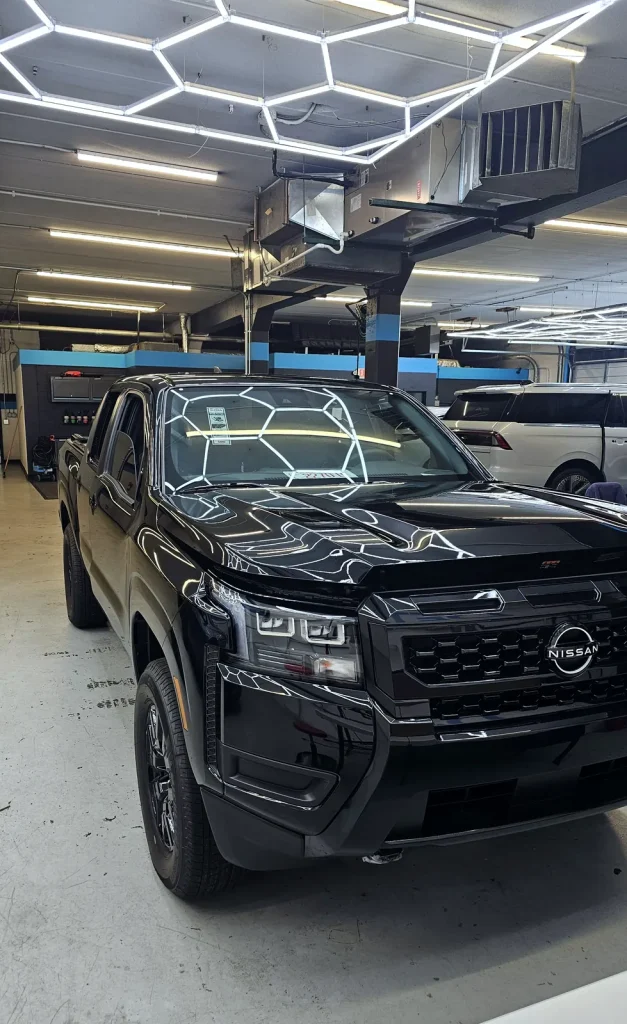 Black Nissan Frontier before its color-change wrap