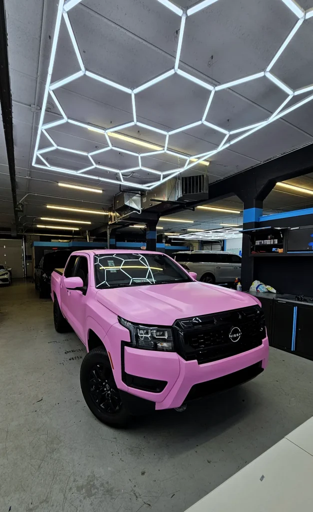 Nissan Frontier after a gloss pink color-change wrap