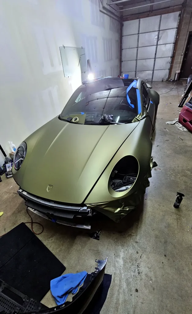 Porsche 911 mid-wrap in the bay