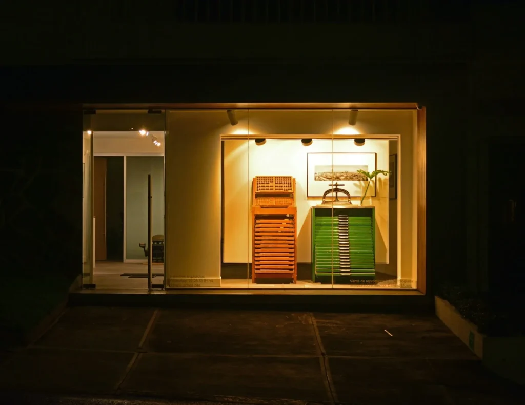 Lit storefront window display at night